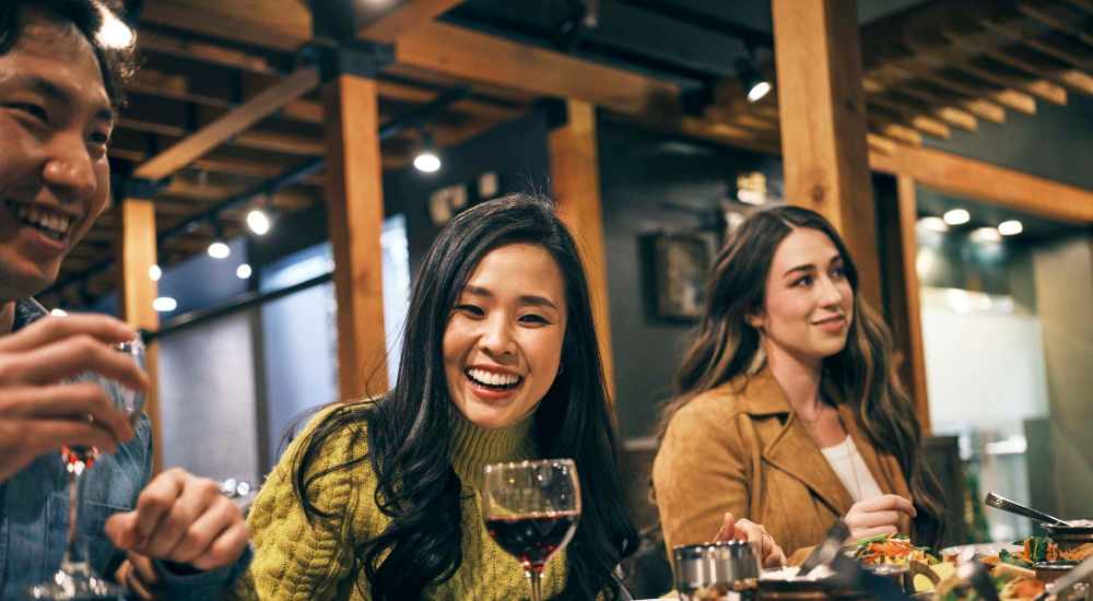 Resident friends having food near Henrietta Place in Rochester, New York