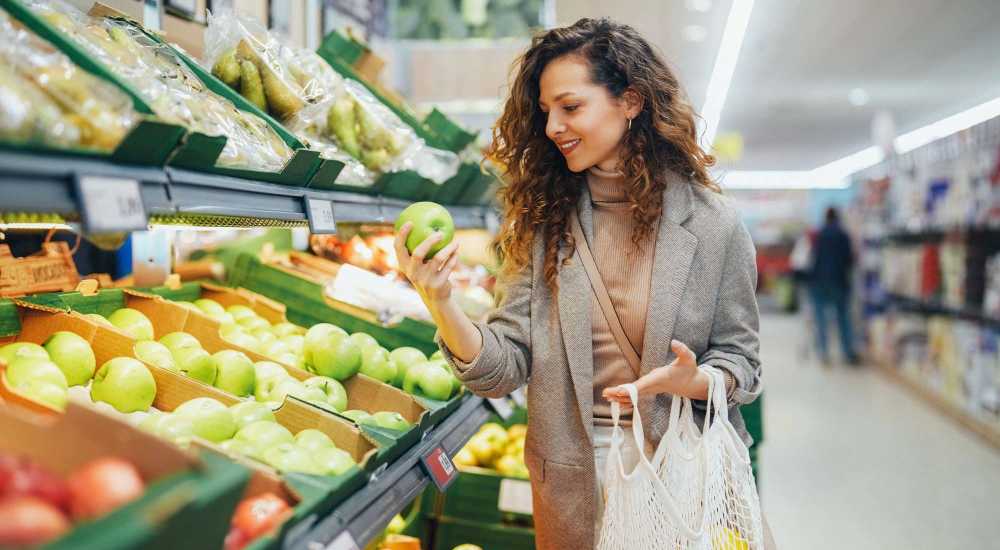 Resident buying fruits in the market near Mount Hope Lofts in Rochester, New York.
