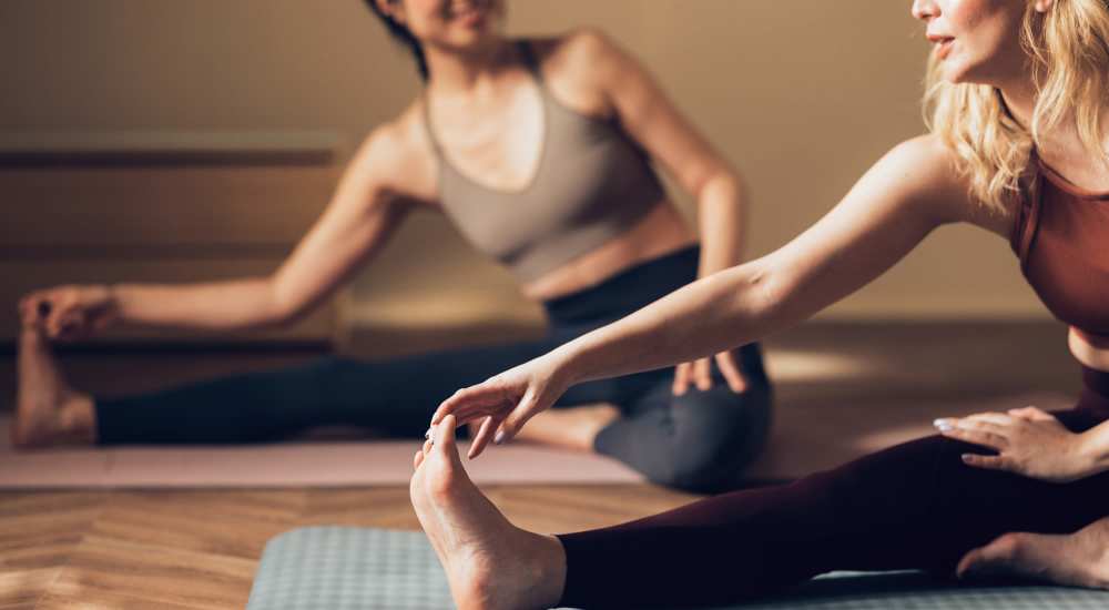 Resident women doing yoga at The Simone in Silver Spring, Maryland 
