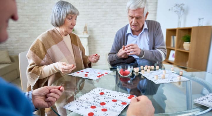 Senior man and woman playing bingo
