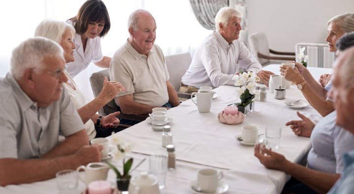 Group of seniors at dining room table