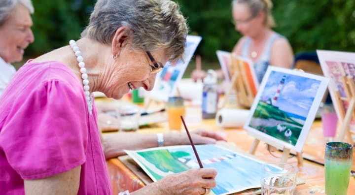 Seniors painting outside