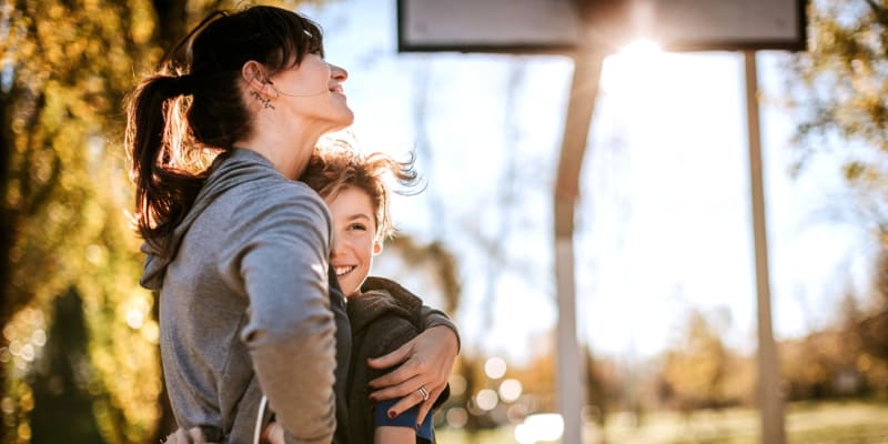 a mother and son playing basketball at Silver Strand II in Coronado, California