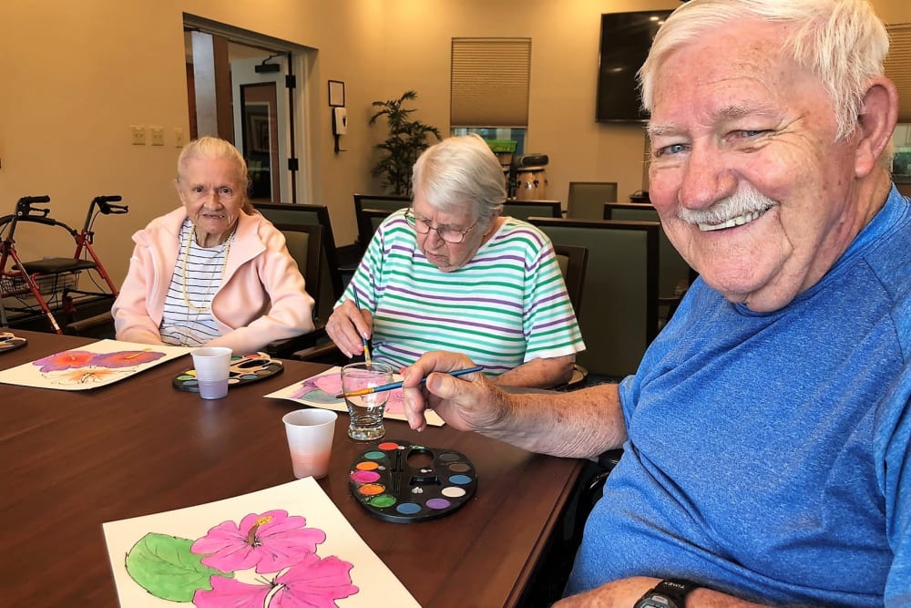 senior residents enjoying painting