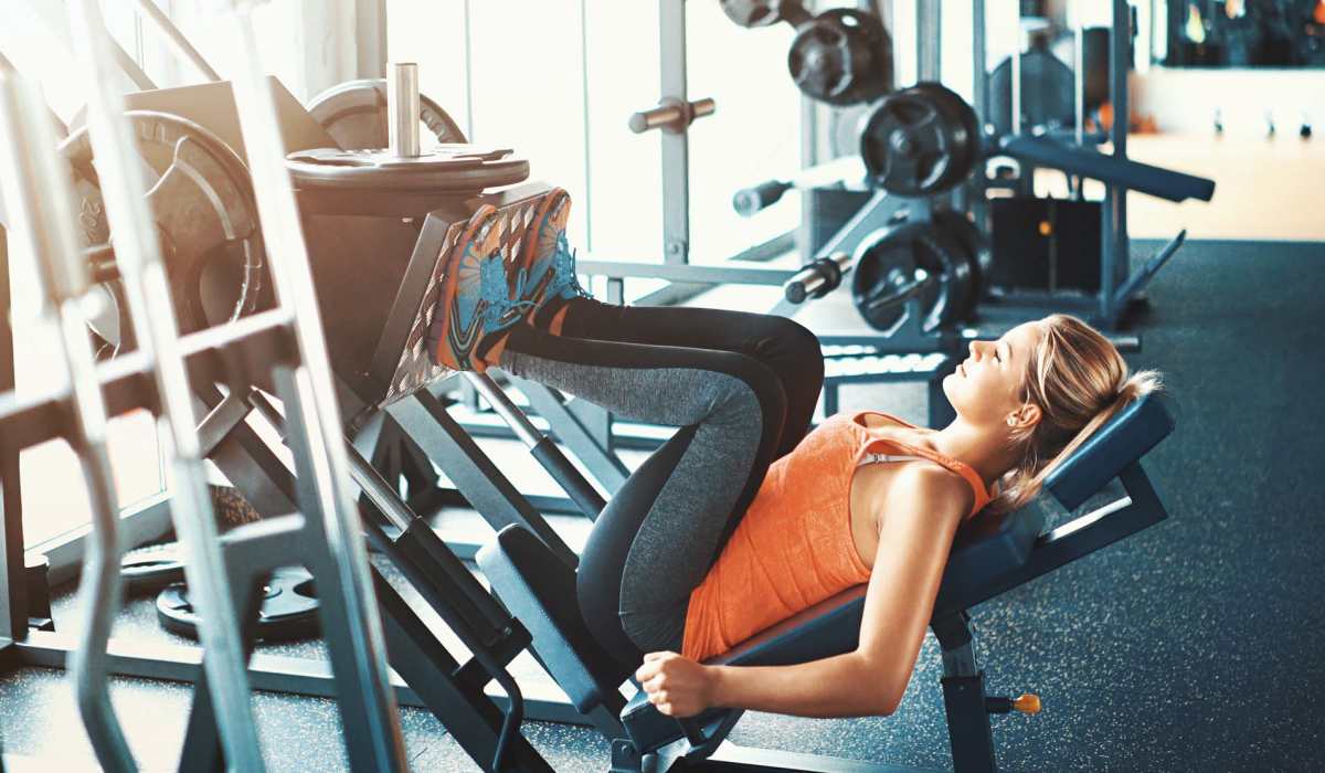 Resident woman working out in a fitness center at The Heights at Waterpointe in Flowood, Mississippi