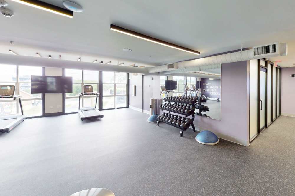 Fitness center with cardio equipment at Altitude at Baton Rouge in Baton Rouge, Louisiana