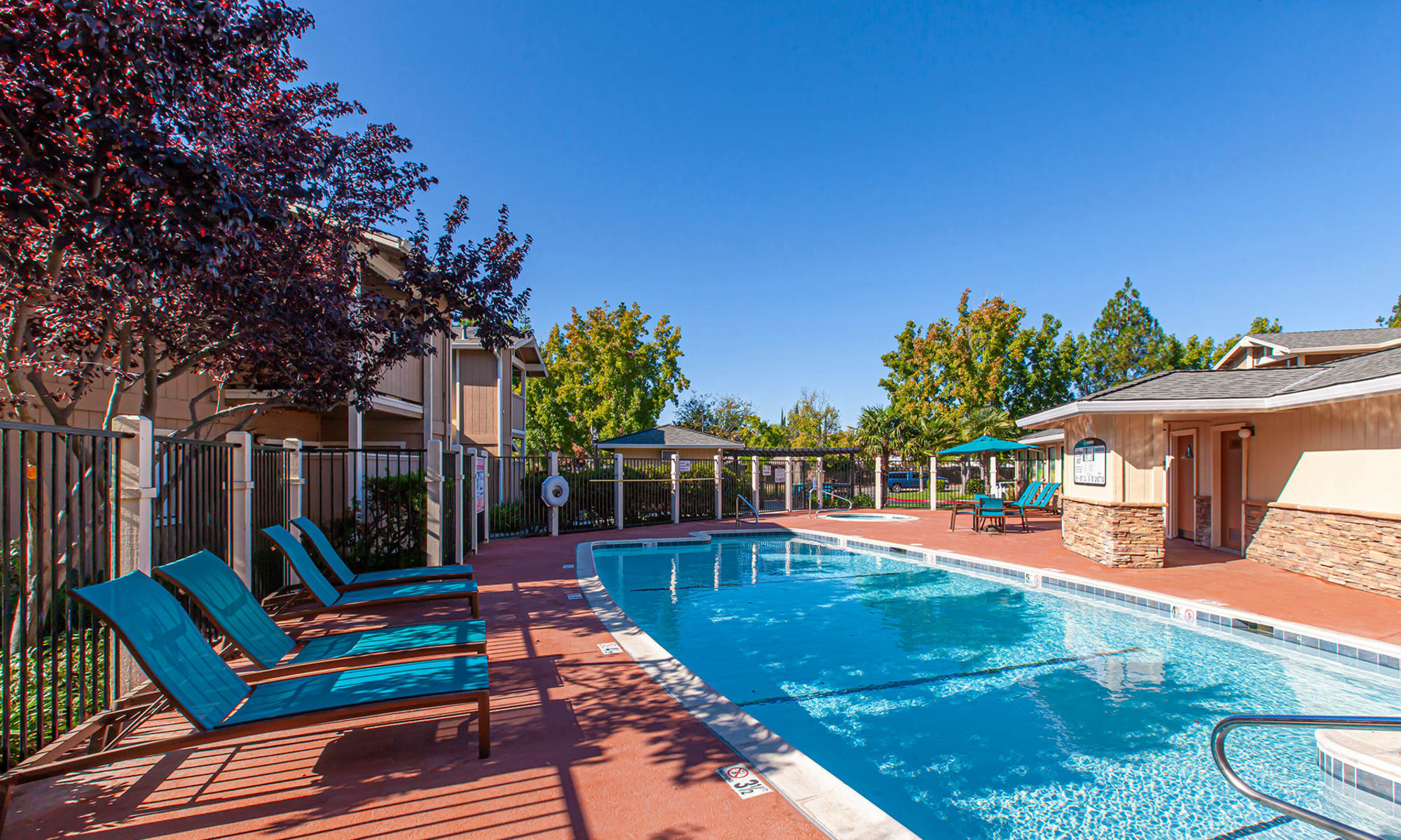 Sparkling Pool area with lounge chairs  in Vacaville, CA