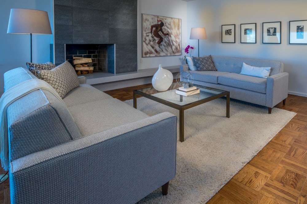 Living room with firepit and modern details at Panorama Apartments in Seattle, Washington