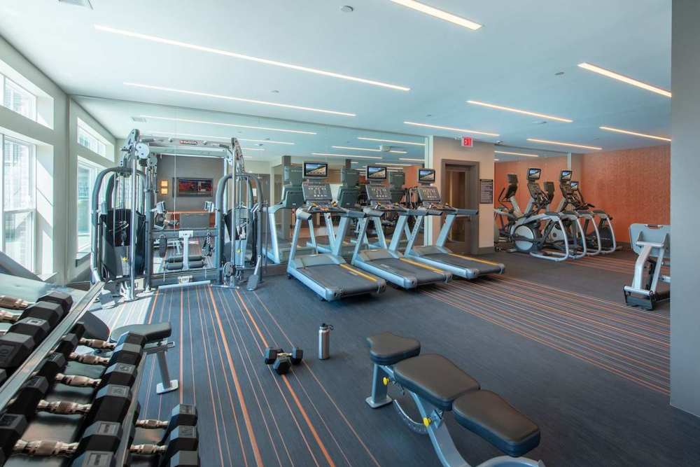 Fitness studio with treadmills and weight machines at The Elms at Signal Hill Station in Manassas, Virginia