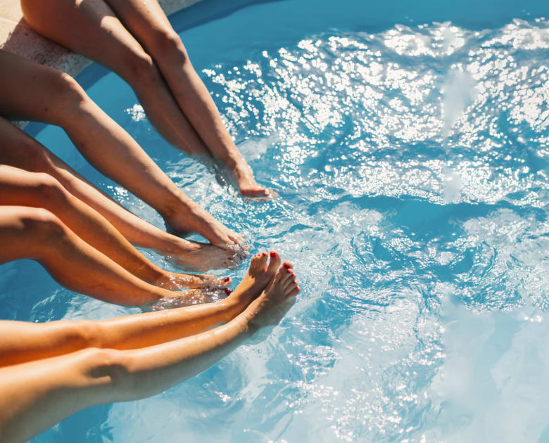 People's legs in pool at Kelson Row at Rocky Hill in Rocky Hill, Connecticut