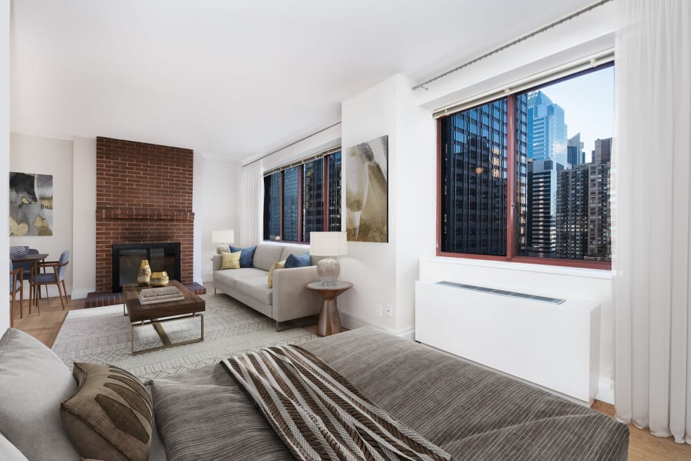 Spacious living room with wood-style flooring at The Ellington in New York, New York