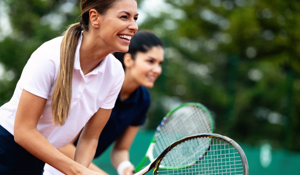 Women playing tennis at Magnolia Court in Orlando, Florida