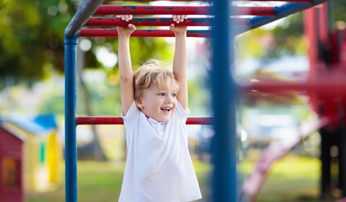 Kid playing on a playground at Delta View Apartments in Antioch, California
