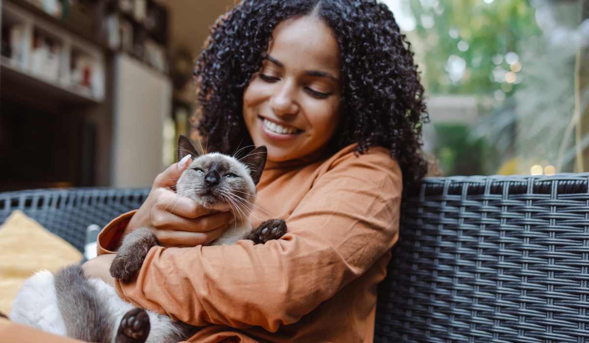 Resident holding her cat at Koz on Broadway in Everett, Washington