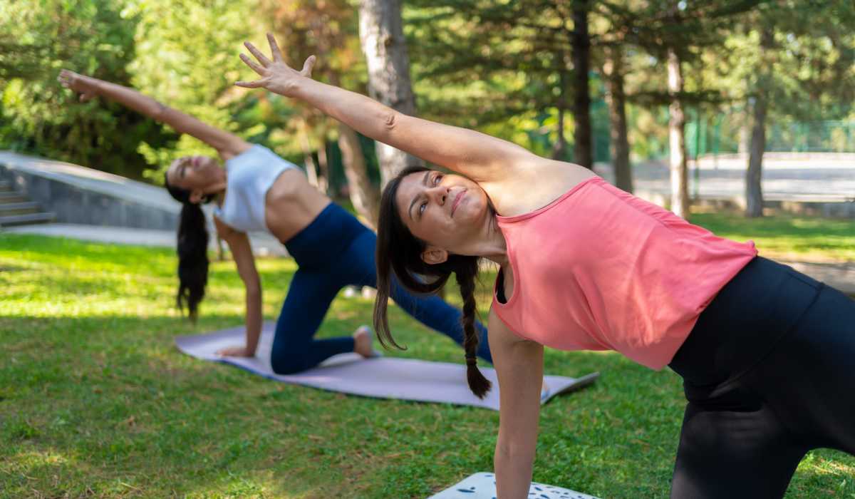 Residents doing yoga in a park near Granite Creek in Rocklin, California