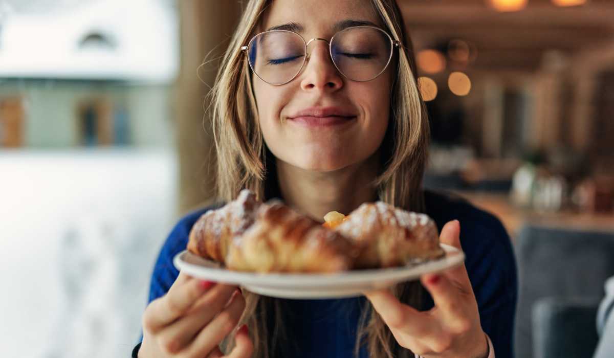 Woman holding a plate of pastries near Brixin Sonora in Fort Wayne, Indiana 