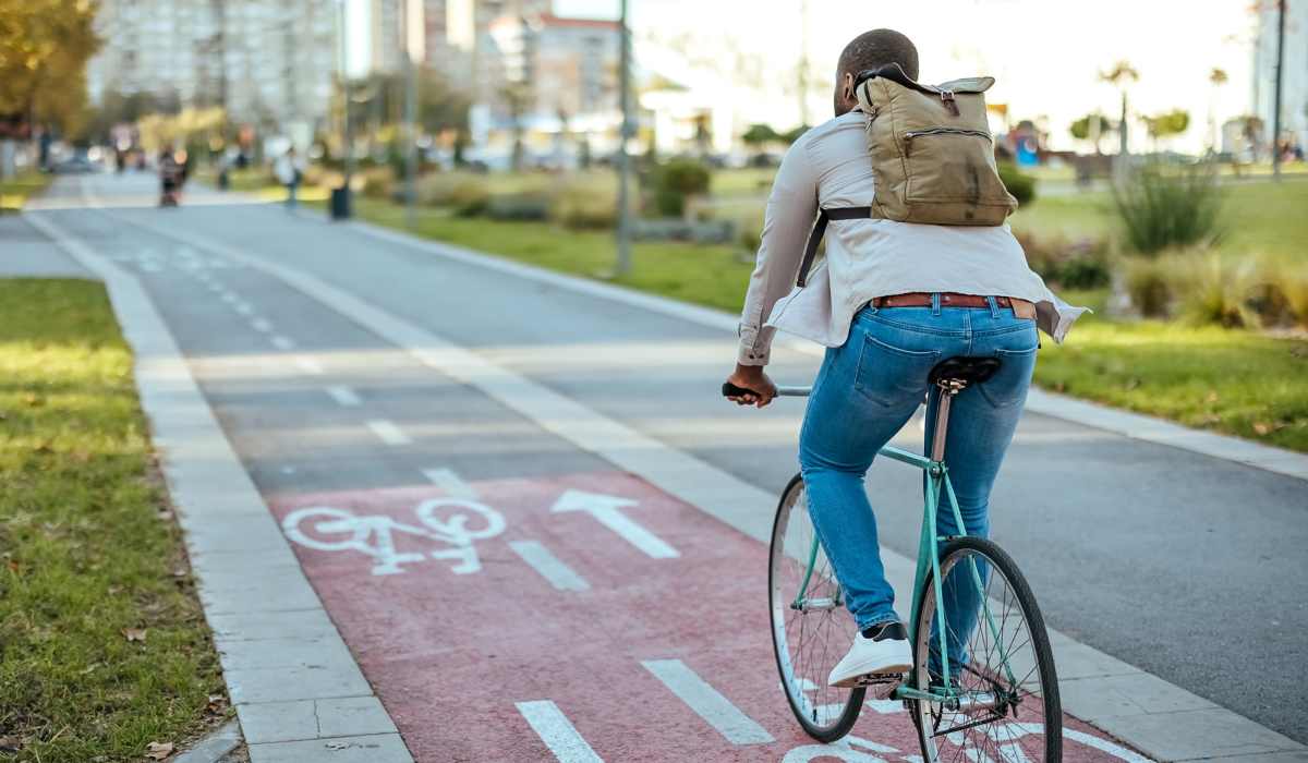 Person riding a bicycle on a bike lane near Brush Factory Lofts in Philadelphia, Pennsylvania 