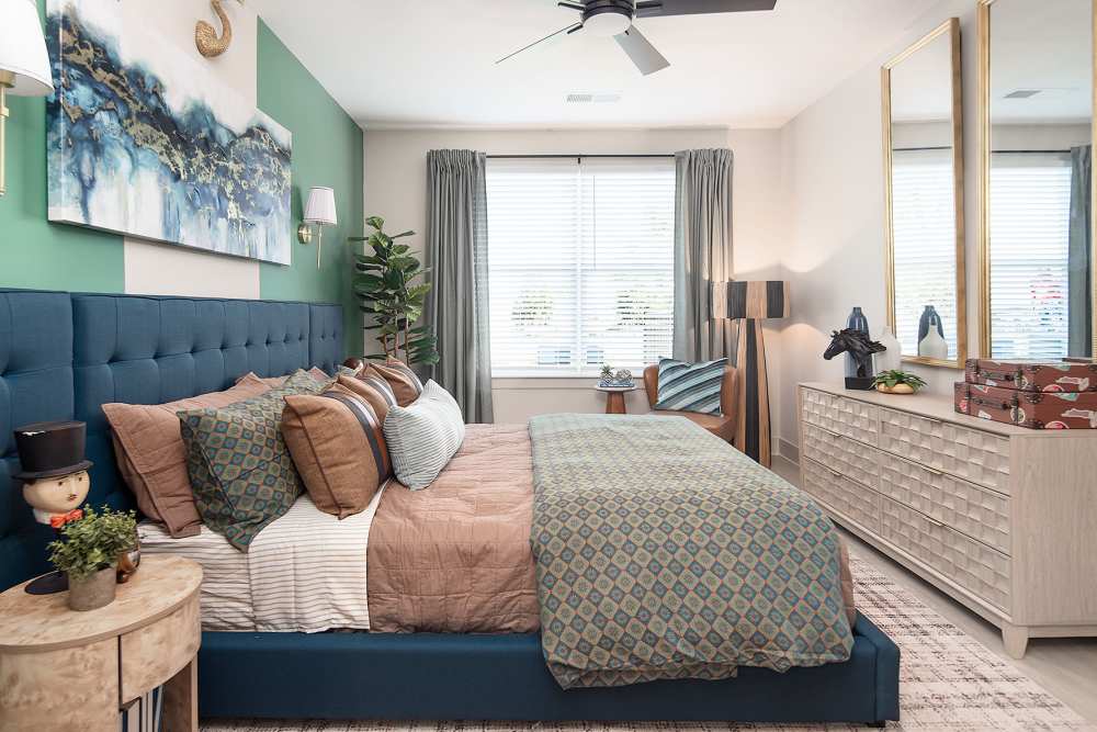 Comfortable one, two, and three bedroom apartment interiors with large windows, ceiling fans, and roomy closets at Cypress Point