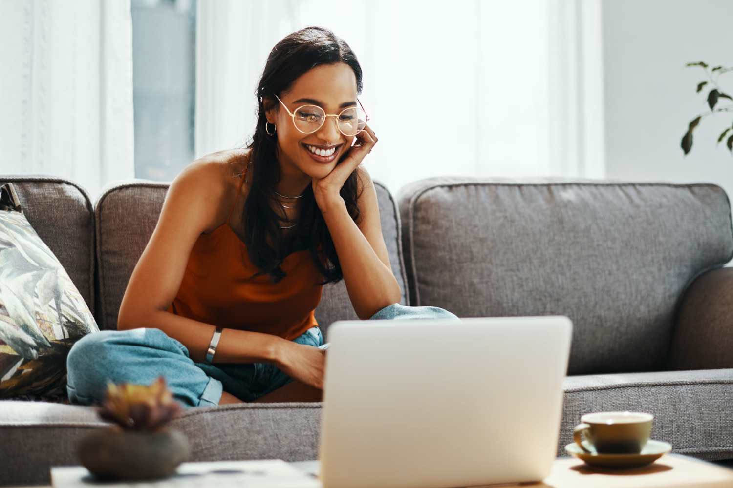 Resident woman using the online payments portal at Manchester Apartments in Manchester, Michigan   