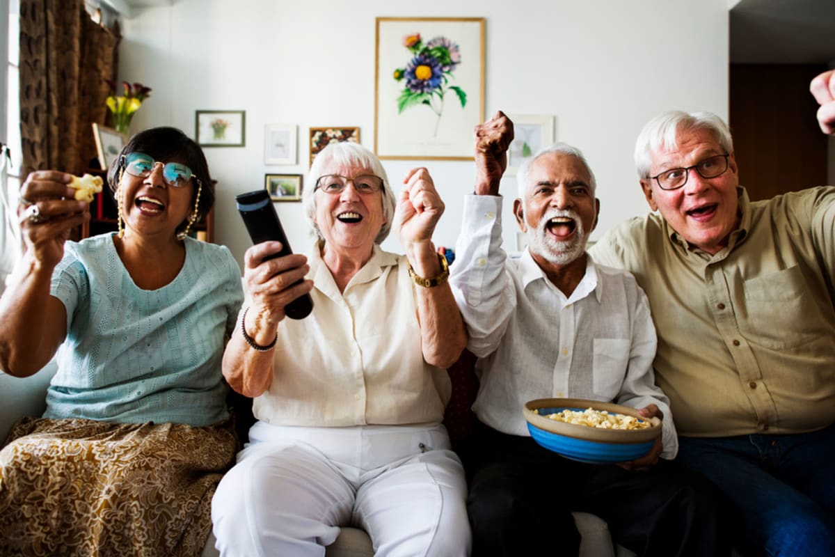 Seniors enjoying a game on TV at Savanna House in Gilbert, Arizona