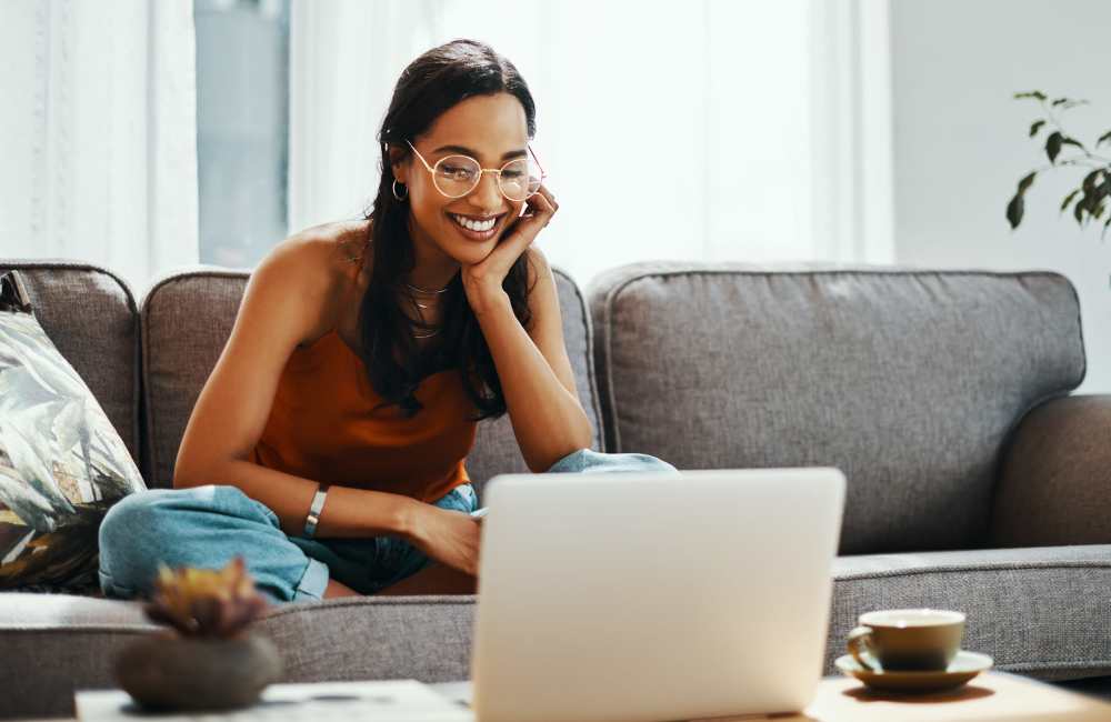 Resident on her laptop at Mountain Breeze Villas in San Bernardino, California