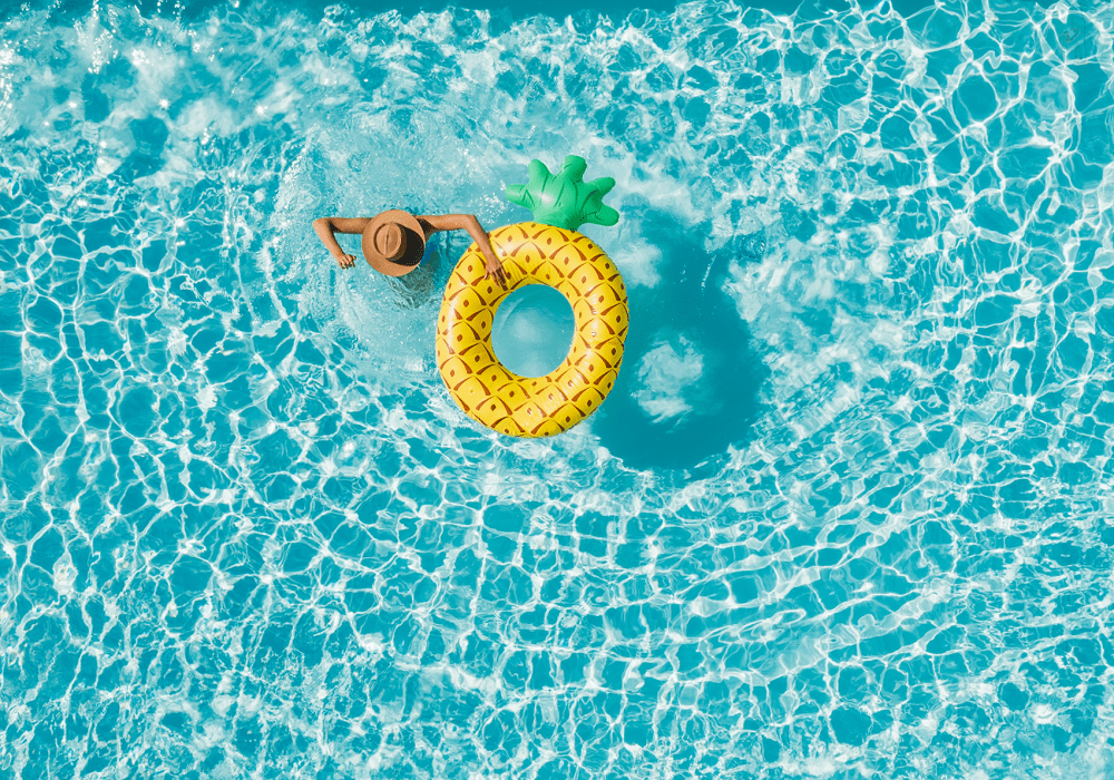 Swimming in pool at Cassia Apartments apartment homes in Santa Maria, California
