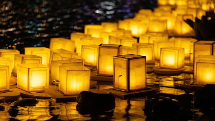 Floating lanterns on river