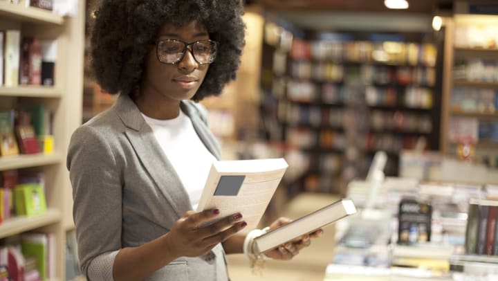 Woman looking at books at a bookstore