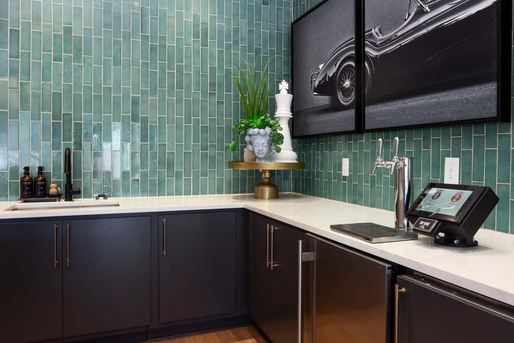 Modern leasing office featuring a coffee bar and resident beer tap at Cypress Point Luxury Apartments