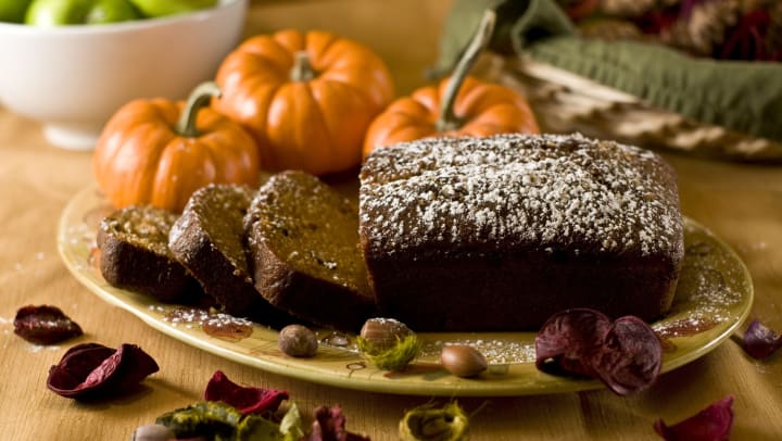 Delicious fresh pumpkin bread topped with powdered sugar surrounded by mini pumpkins at The Davis