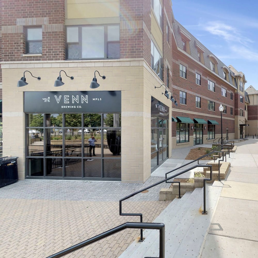 Venn Brewing and other retailers on street level at Oaks Station Place in Minneapolis, Minnesota