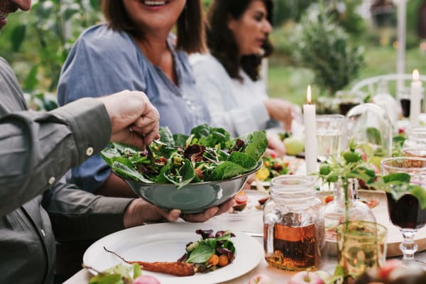 Residents sharing a meal near The Palms Apartments in Sacramento, California