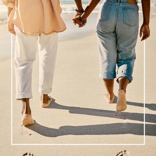 Residents walking on the beach near Cottage Street at eTown in Jacksonville, Florida