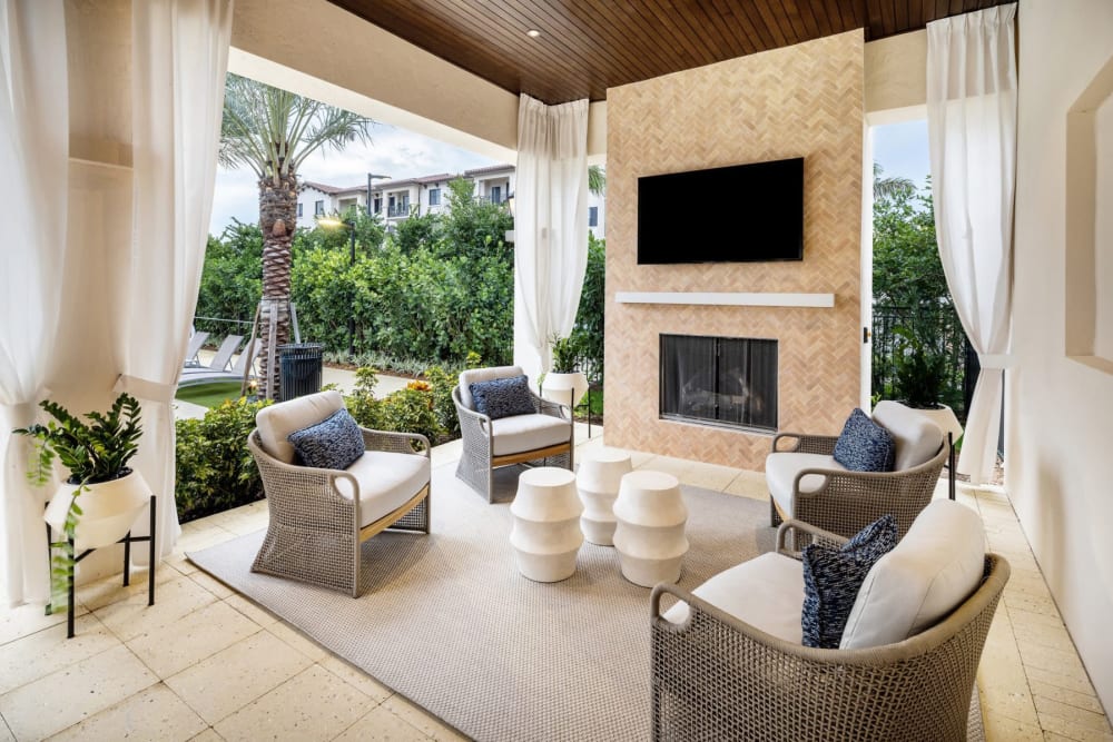 Serene poolside retreat with lounge chairs, palm trees at Locklyn West Palm, West Palm Beach, Florida