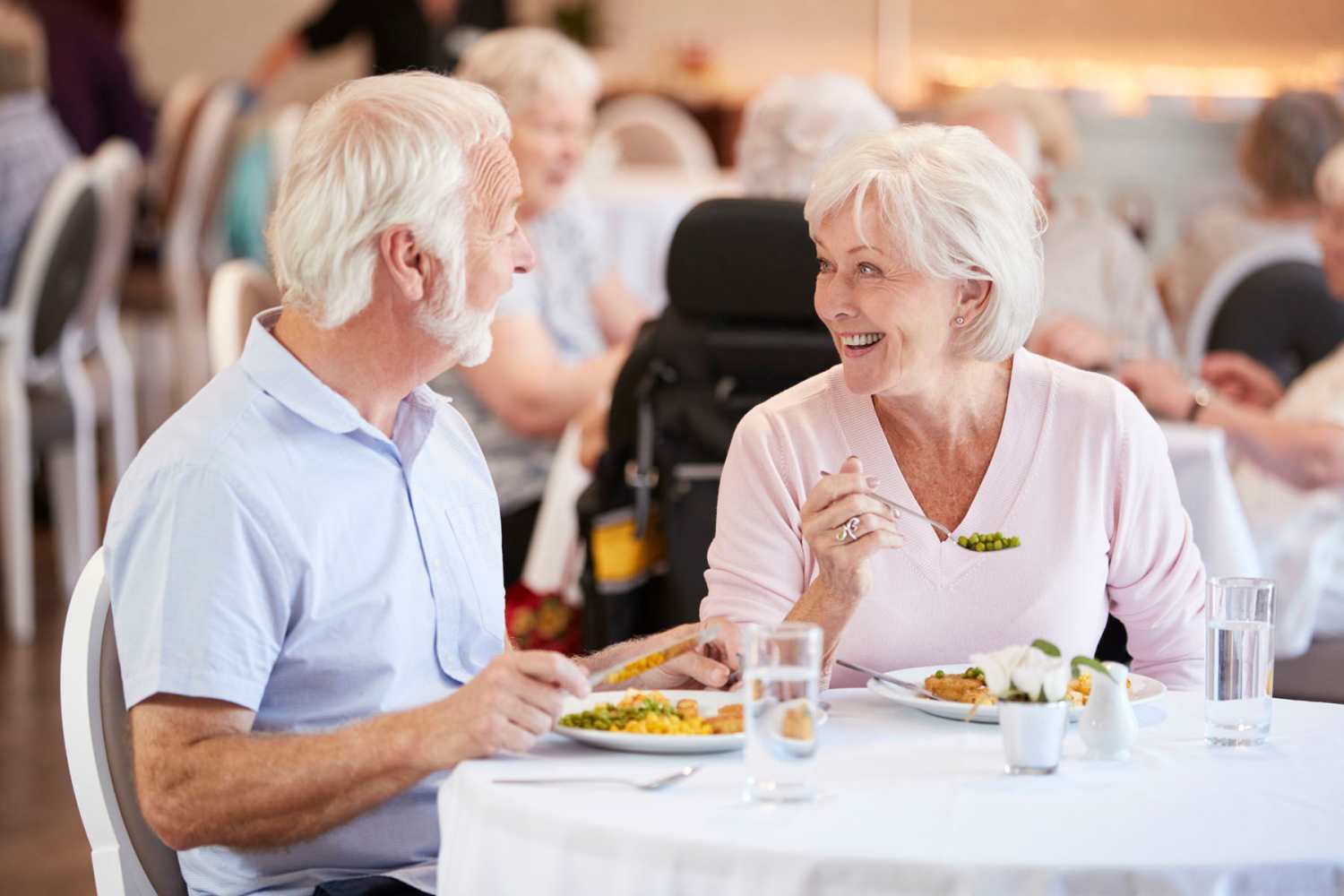Residents having food in restaurant near Woodbrook Apartments in Three Rivers, Michigan