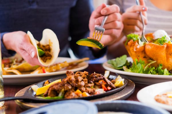 Residents enjoying tacos at a restaurant near Parkside Towns in Richardson, Texas