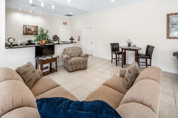 Clubhouse with cozy sofa at Cloisters of Concord in Concord, North Carolina
