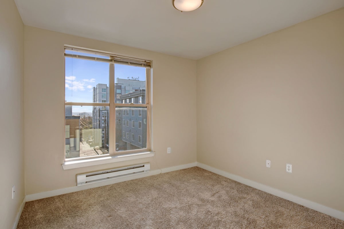 Amazing city view from an apartment bedroom's bay window at Vantage Park Apartments in Seattle, Washington