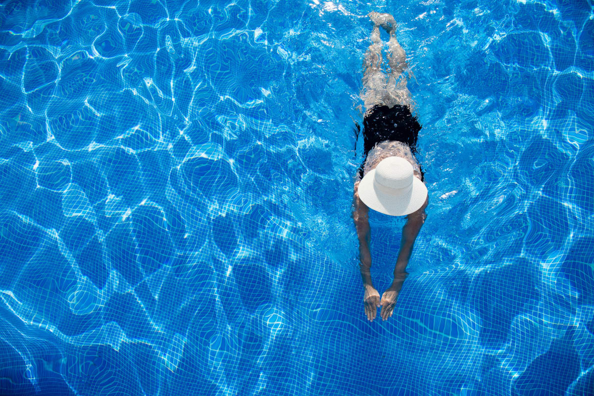 Aerial view of a resident swimming laps in the pool at Amira Lake Elmo in Lake Elmo, Minnesota