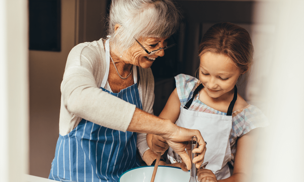 A resident cooking with her grandchild at Fair Haven in Birmingham, Alabama. 