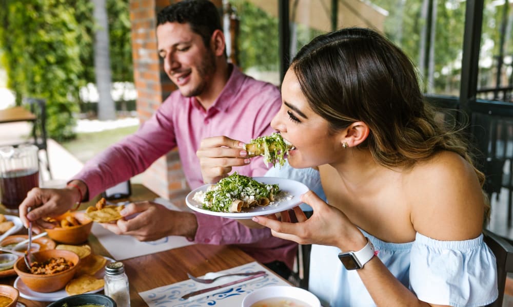 Resident couple going out for mexican food near Stone Ranch Townhomes in Seguin, Texas