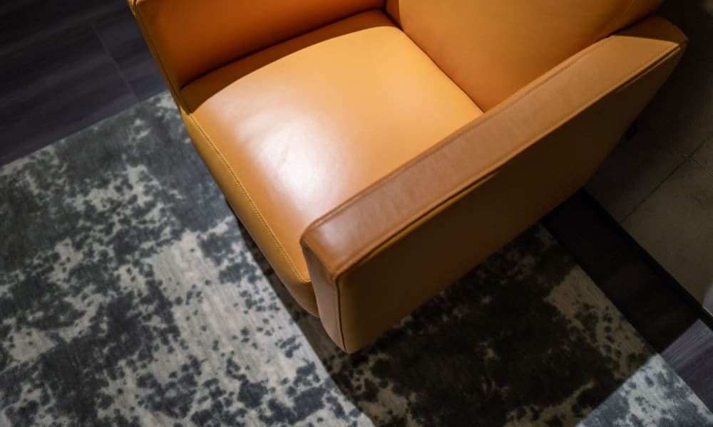 A chair in an apartment living room at Vue North Apartments in Rochester, Minnesota