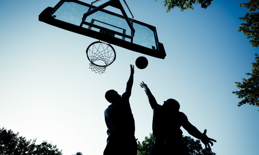 Student playing basketball near Brookside Downtown in Columbia, Missouri