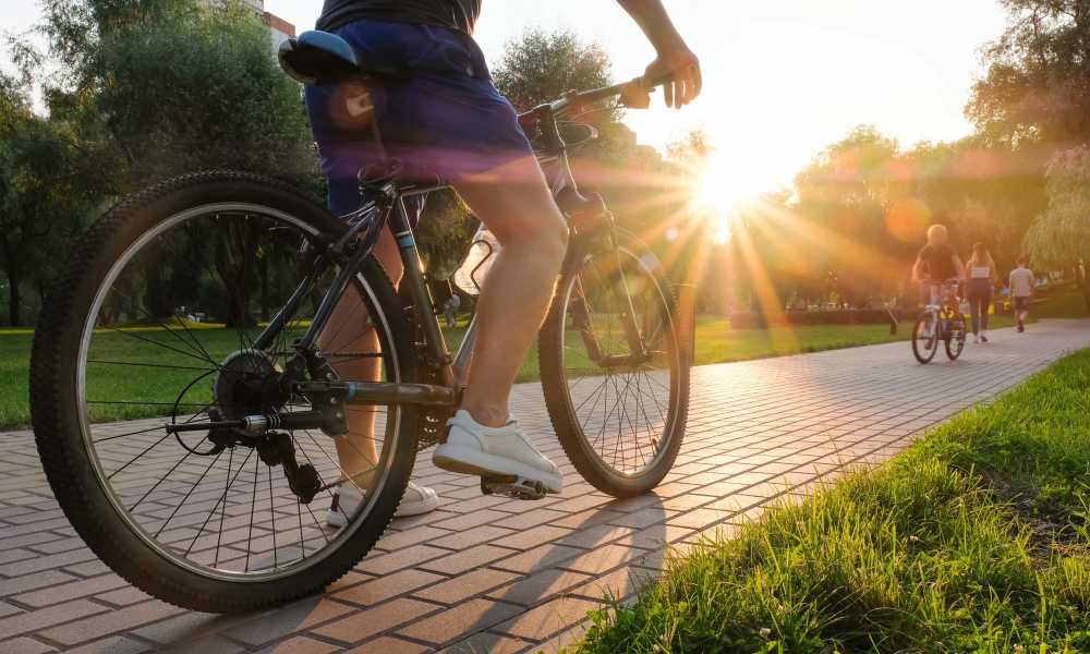 Resident cycling near The Edmond in Rochester, New York