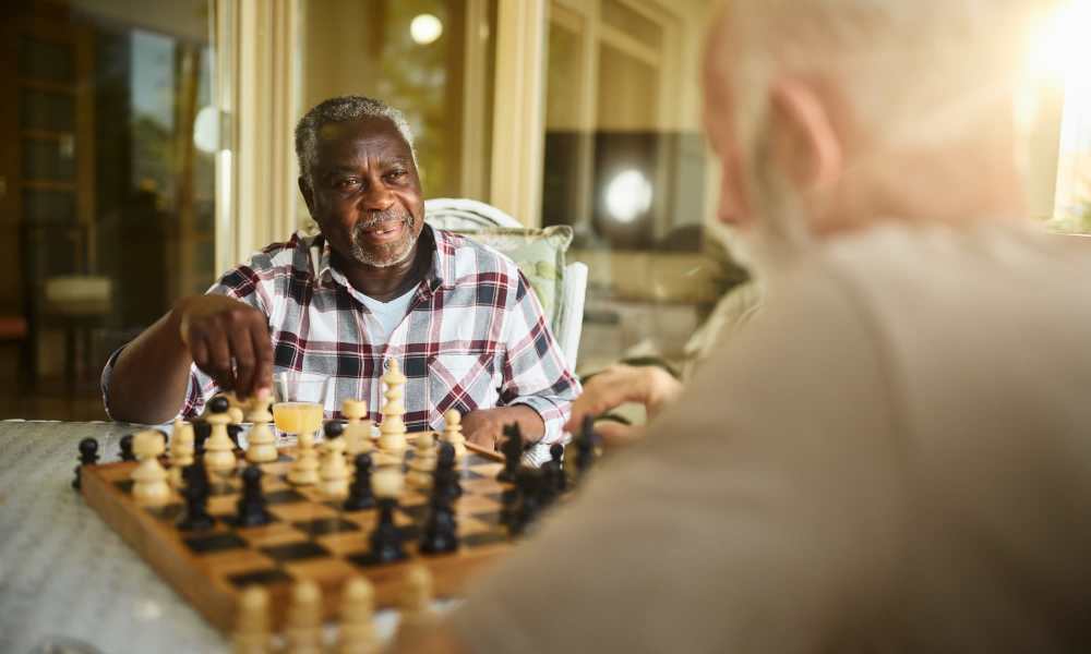 A construction employee playing chess of Heirloom by Ovation in Las Vegas,Nevada