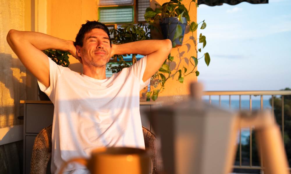 Resident enjoying in balcony Williston Pointe in Gainesville, Florida