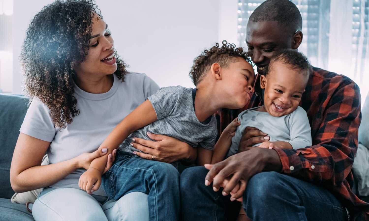 Residents laughing with their kids at Serenity Apartments in Leesburg, Florida