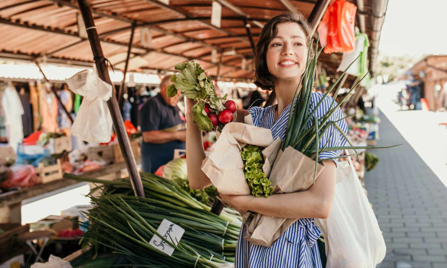 Resident shopping at local farmers market at The Carlton At Lake Dexter in Winter Haven, Florida