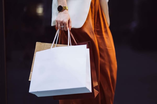 Resident shopping at a boutique near Hamlet Court Apartments in Rochester, New York