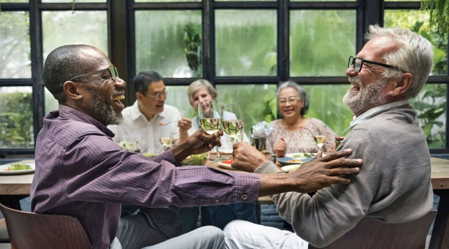 Families and residents getting to know each other at a social event at Cascade Park Gardens Memory Care in Tacoma, Washington